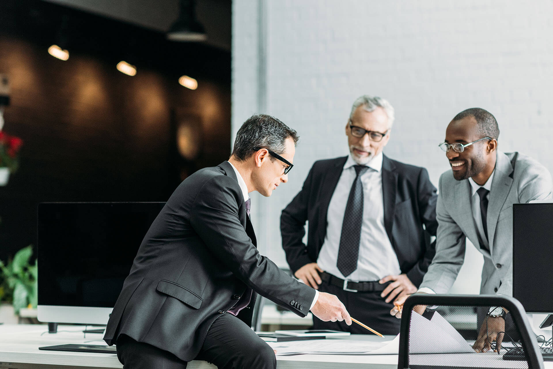 multiethnic-businessmen-discussing-new-business-st-2022-12-16-17-17-53-utc.jpg